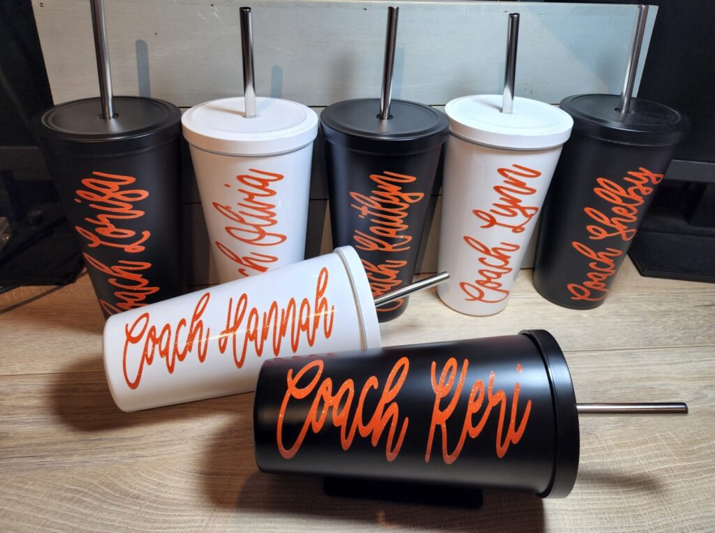 a picture of tumblers that I personalized with names of the coaches and athletes on a cheer team