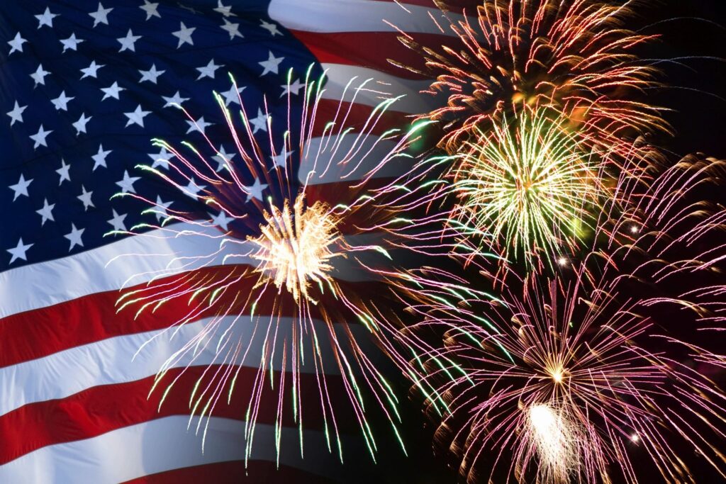 a picture of American flag and fireworks