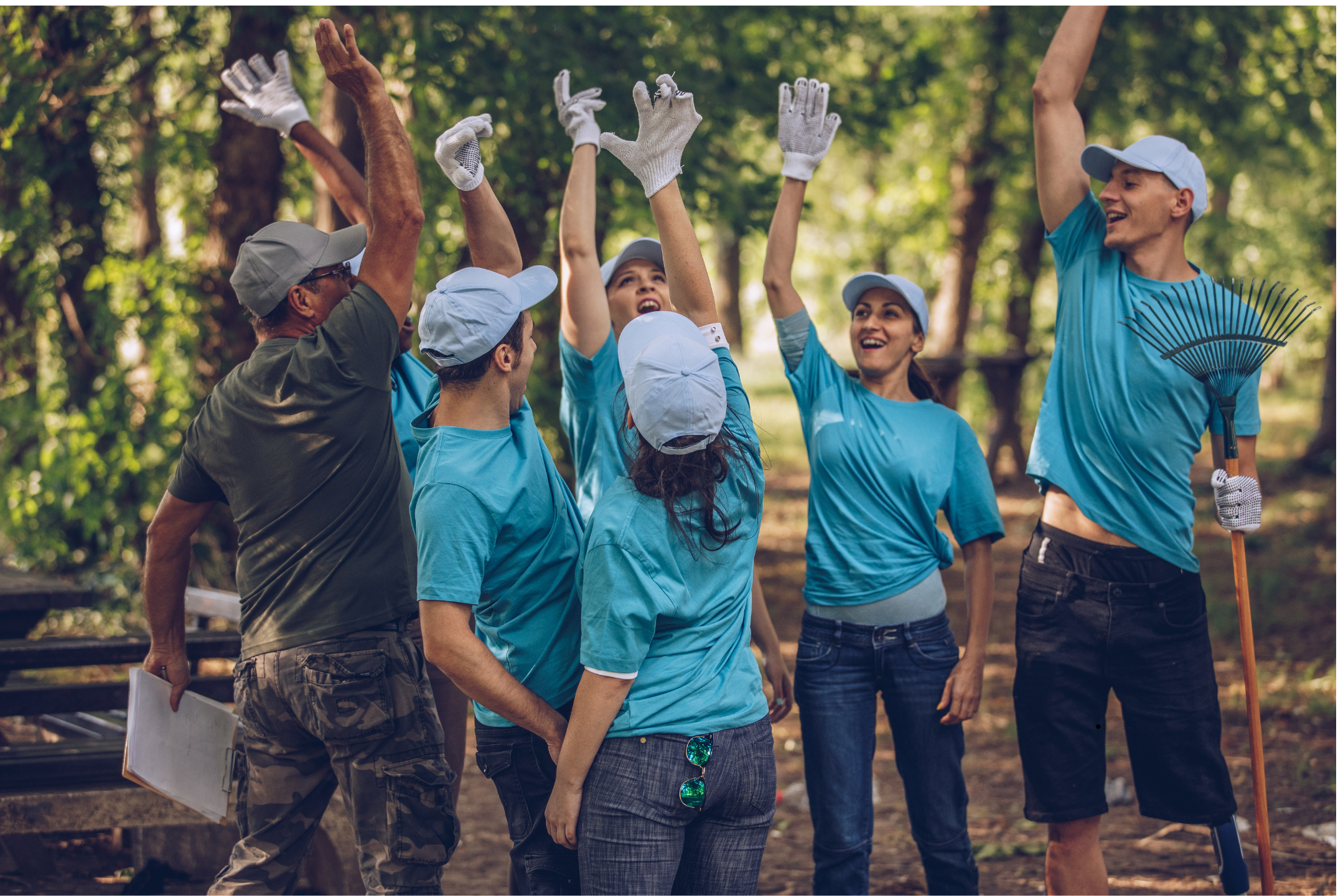several adults in matching tshirts and hats at a clean up event